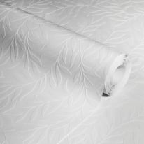 Studio photograph of the white trailing leaf wallpaper roll highlighting the deep relief of the luxury textured vinyl.
